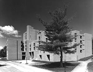 Christensen Hall with benches and lamps in foreground.