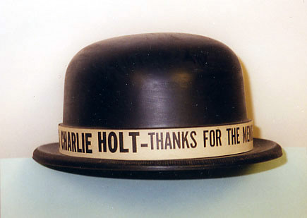 Black bowler with celebratory writing around hat