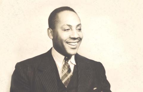 Young Ivorey Cobb, smiling wearing a pinstripe suit circa 1933